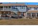 Charming townhome with a combination brick and siding facade and front yard at 2540 E Geddes Pl, Centennial, CO 80122