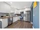 Bright kitchen with stainless steel appliances, wood countertops, and white cabinets at 2540 E Geddes Pl, Centennial, CO 80122