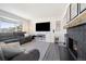 Comfortable living room with a large TV and a cozy fireplace at 2540 E Geddes Pl, Centennial, CO 80122