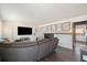 Comfortable living room with a large TV and a cozy fireplace at 2540 E Geddes Pl, Centennial, CO 80122