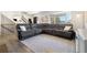 Spacious living room featuring a comfortable sectional sofa and hardwood floors at 2540 E Geddes Pl, Centennial, CO 80122