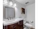 Stylish bathroom featuring a modern vanity, mirror, and updated fixtures at 4206 E Maplewood Way, Centennial, CO 80121