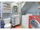 Cozy bathroom features modern sink and red front load washer/dryer at 100 Wildcat Ln, Boulder, CO 80304