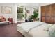 Cozy bedroom with natural light, plants, carpet and closet space at 100 Wildcat Ln, Boulder, CO 80304