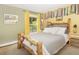 Comfortable bedroom with a wood frame bed, natural light, and tranquil setting at 100 Wildcat Ln, Boulder, CO 80304