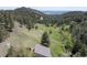 Enjoy views from this hillside home surrounded by dense trees and natural beauty at 100 Wildcat Ln, Boulder, CO 80304