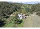 Aerial view of a hillside home featuring a deck and gorgeous natural surroundings at 100 Wildcat Ln, Boulder, CO 80304