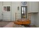 Charming front entrance with wooden deck and unique architectural details at 100 Wildcat Ln, Boulder, CO 80304