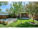 The backyard features a lush lawn and raised garden beds at 1109 Jersey St, Denver, CO 80220