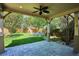 The backyard has a covered patio with room for seating overlooking the lawn and garden at 1109 Jersey St, Denver, CO 80220