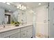 Stylish bathroom with a double sink vanity, frameless glass shower, and modern fixtures at 1109 Jersey St, Denver, CO 80220