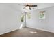 Bright bedroom featuring carpet, a ceiling fan, and three windows that provide plenty of natural light at 1109 Jersey St, Denver, CO 80220