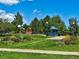Inviting community park with playground, basketball court, flower beds, and green lawns at 1109 Jersey St, Denver, CO 80220