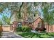 Two-story home featuring brick and siding, a driveway, and garage at 1109 Jersey St, Denver, CO 80220