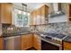 Updated kitchen with stainless steel appliances, granite countertops, and lots of natural light at 1109 Jersey St, Denver, CO 80220