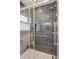 Updated shower with sleek, dark tile, glass doors, and modern fixtures for a spa-like experience at 1109 Jersey St, Denver, CO 80220
