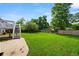 Lush green backyard with a patio, stairs leading to the deck, and a well-maintained lawn perfect for outdoor activities at 9196 W Maplewood Ave, Littleton, CO 80123