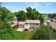 Aerial view of a backyard featuring a deck, patio area, and a lush green lawn, perfect for outdoor enjoyment at 9196 W Maplewood Ave, Littleton, CO 80123