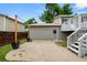 A backyard featuring a deck with stairs, a patio, and a fenced yard at 9196 W Maplewood Ave, Littleton, CO 80123