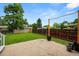 A well-maintained backyard with a green lawn, concrete patio, and privacy fence at 9196 W Maplewood Ave, Littleton, CO 80123