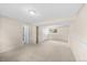 Expansive basement with wall-to-wall carpeting and multiple closets at 9196 W Maplewood Ave, Littleton, CO 80123