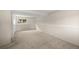 Spacious basement featuring wall-to-wall carpeting and a bright window at 9196 W Maplewood Ave, Littleton, CO 80123