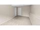 Well-lit basement with wall-to-wall carpeting and two large closets at 9196 W Maplewood Ave, Littleton, CO 80123
