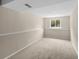Large basement with wall-to-wall carpeting and plenty of natural light at 9196 W Maplewood Ave, Littleton, CO 80123