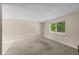 Neutral bedroom with carpet, a window offering natural light, and ample space at 9196 W Maplewood Ave, Littleton, CO 80123