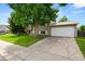 Charming two-story home with an attached garage and well-maintained lawn in a desirable neighborhood at 9196 W Maplewood Ave, Littleton, CO 80123