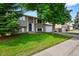 Charming two-story home with a well-maintained lawn and mature tree in a desirable neighborhood at 9196 W Maplewood Ave, Littleton, CO 80123