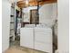 A functional laundry room with washer, dryer and water heater, ready for your convenience at 9196 W Maplewood Ave, Littleton, CO 80123