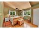 Cozy bedroom with wood floors, a light green wall, and bright windows at 4701 Homestead St, Bow Mar, CO 80123