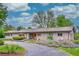 Single story home with attractive front yard, sidewalk, and covered porch at 4701 Homestead St, Bow Mar, CO 80123