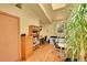 Bright office space with wood floors, a closet, large plant and built-in bookshelves at 4701 Homestead St, Bow Mar, CO 80123