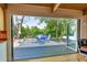 Relaxing deck area with outdoor dining and an expansive lawn at 4701 Homestead St, Bow Mar, CO 80123
