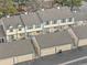 Aerial view of townhomes showing garages and private patios at 7068 E Briarwood Dr, Centennial, CO 80112