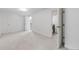 Bedroom featuring neutral carpet and a doorway to a laundry room at 7068 E Briarwood Dr, Centennial, CO 80112