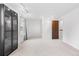 Spacious bedroom featuring neutral walls, plush carpet, and a built-in cabinet at 7068 E Briarwood Dr, Centennial, CO 80112