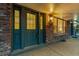 Close-up of double front door showcasing brick facade, porch, and sidelight window at 7068 E Briarwood Dr, Centennial, CO 80112