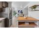 View from the kitchen featuring stainless steel appliances, center island, and dining area at 7068 E Briarwood Dr, Centennial, CO 80112