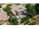 Aerial view of home featuring a patio with two hot tubs, deck, and landscaped backyard at 16458 W Ellsworth Dr, Golden, CO 80401