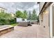 This backyard features two hot tubs, a stone fire pit, and a stamped concrete patio at 16458 W Ellsworth Dr, Golden, CO 80401