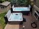 This backyard features two hot tubs with privacy panels, stamped concrete, and a shed at 16458 W Ellsworth Dr, Golden, CO 80401
