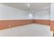 Cozy finished basement featuring wainscotting, plush carpet and recessed lighting at 16458 W Ellsworth Dr, Golden, CO 80401