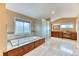 This spacious bathroom features a large soaking tub, walk-in shower, and dual vanities at 16458 W Ellsworth Dr, Golden, CO 80401