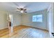 Bedroom with hardwood floors, a window, a ceiling fan and an ensuite bathroom at 16458 W Ellsworth Dr, Golden, CO 80401