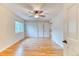 Bedroom with hardwood floors, a ceiling fan, window, and a double-door closet at 16458 W Ellsworth Dr, Golden, CO 80401