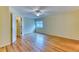 This bedroom features a window, wood floors, and a ceiling fan at 16458 W Ellsworth Dr, Golden, CO 80401