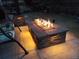 This backyard features a stone fire pit with glass rocks and an inviting outdoor space at 16458 W Ellsworth Dr, Golden, CO 80401